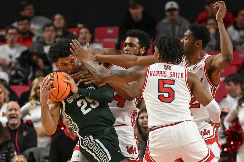 Jan 21, 2024; College Park, Maryland, USA;  dMaryland Terrapins defender collapse on Michigan State Spartans forward Malik Hall (25) uring the second half at Xfinity Center. Mandatory Credit: Tommy Gilligan-USA TODAY Sports