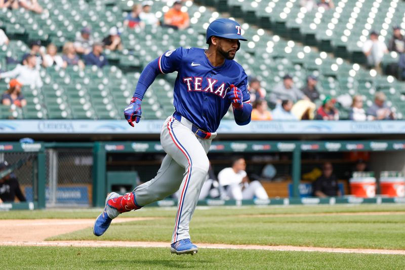 Apr 17, 2024; Detroit, Michigan, USA; Texas Rangers outfielder Leody Taveras (3) hits a single in the seventh inning against the Detroit Tigers at Comerica Park. Mandatory Credit: Brian Bradshaw Sevald-USA TODAY Sports