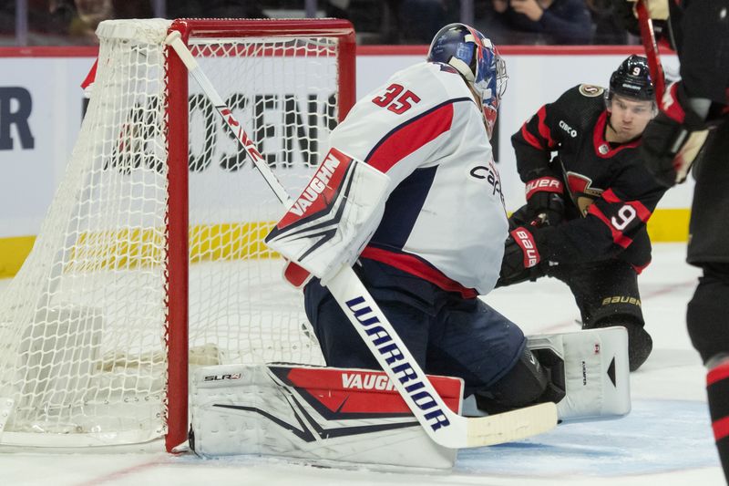 Oct 18, 2023; Ottawa, Ontario, CAN; Ottawa Senators center Josh Norris (9) scores against Washington Capitals goalie Darcy Kuemper (35) in the first period at the Canadian Tire Centre. Mandatory Credit: Marc DesRosiers-USA TODAY Sports