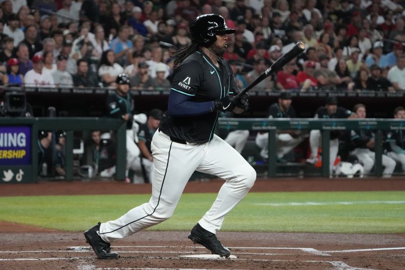 Aug 9, 2024; Phoenix, Arizona, USA; Arizona Diamondbacks first base Josh Bell (36) hits a single against the Philadelphia Phillies in the first inning at Chase Field. Mandatory Credit: Rick Scuteri-USA TODAY Sports