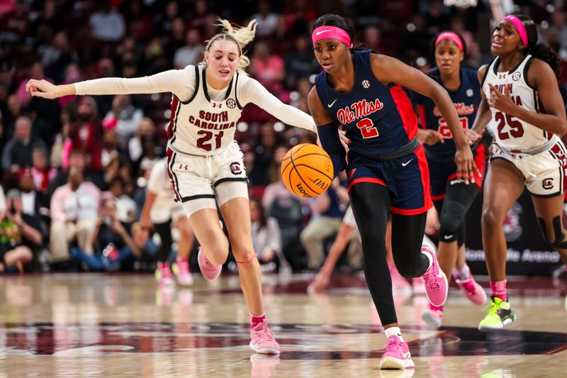 Feb 4, 2024; Columbia, South Carolina, USA; Ole Miss Rebels guard Marquesha Davis (2) brings the ball up past South Carolina Gamecocks forward Chloe Kitts (21) in the second half at Colonial Life Arena. Mandatory Credit: Jeff Blake-USA TODAY Sports