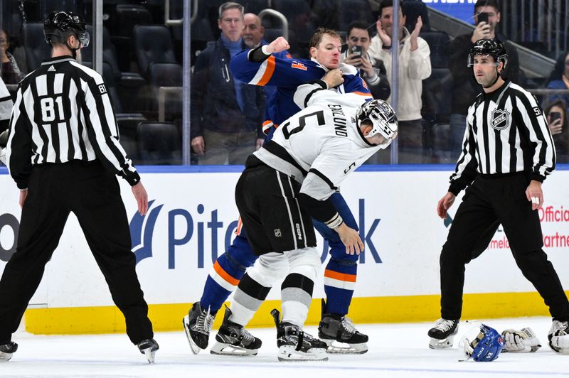 Dec 9, 2023; Elmont, New York, USA; New York Islanders defenseman Scott Mayfield (24) and Los Angeles Kings defenseman Andreas Englund (5) exchange blows during the second period at UBS Arena. Mandatory Credit: John Jones-USA TODAY Sports