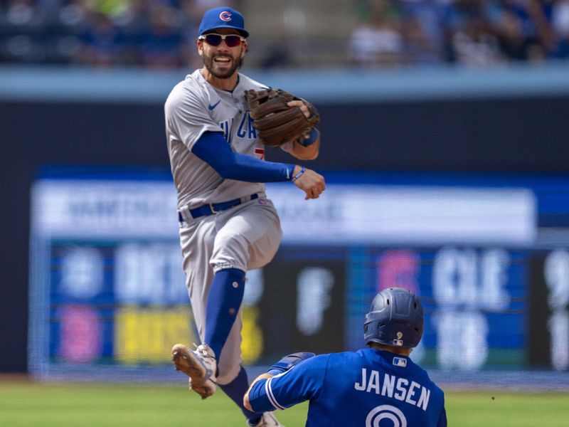 Aug 13, 2023; Toronto, Ontario, CAN; Chicago Cubs shortstop Dansby Swanson (7) turns the double play against the Toronto Blue Jays during the sixth inning at Rogers Centre. Mandatory Credit: Kevin Sousa-USA TODAY Sports