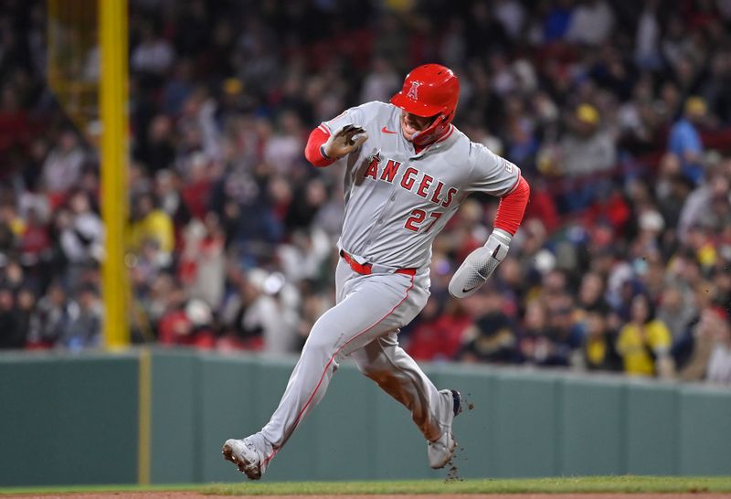 Apr 12, 2024; Boston, Massachusetts, USA; Los Angeles Angels center fielder Mike Trout (27) runs home on a home run by left fielder Taylor Ward (3) during the sixth inning against the Boston Red Sox at Fenway Park. Mandatory Credit: Eric Canha-USA TODAY Sports