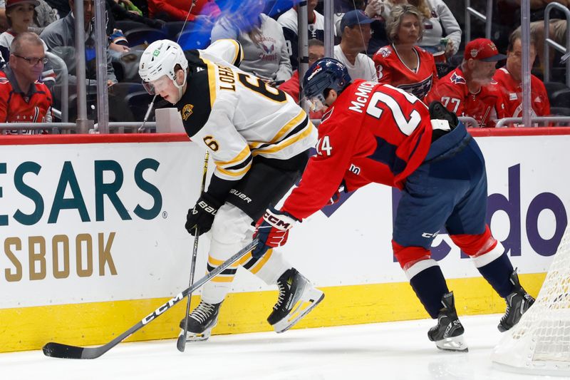 Oct 5, 2024; Washington, District of Columbia, USA; Boston Bruins defenseman Mason Lohrei (6) and Washington Capitals center Connor McMichael (24) battle for the puck in the first period at Capital One Arena. Mandatory Credit: Geoff Burke-Imagn Images