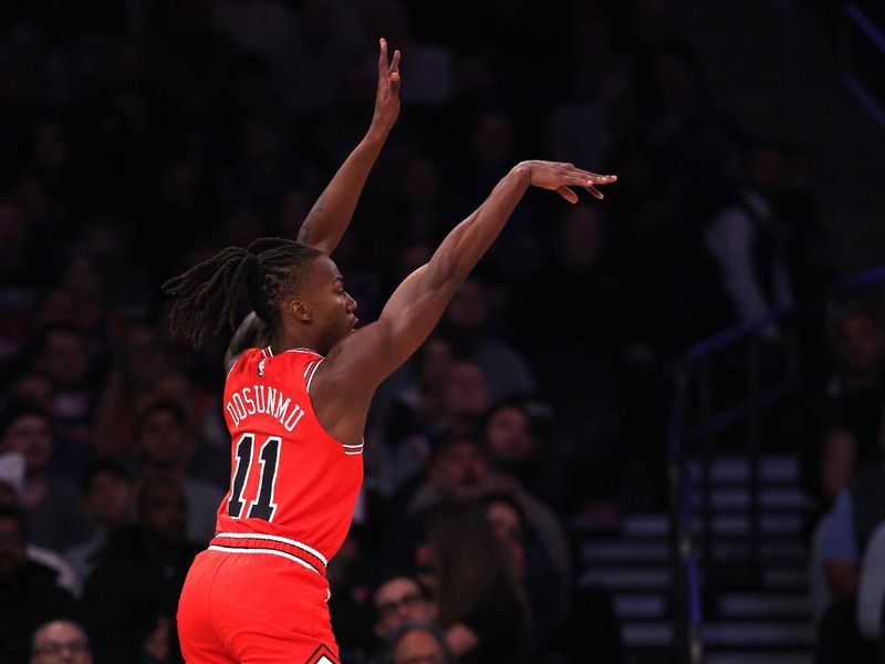 NEW YORK, NEW YORK - NOVEMBER 13: Ayo Dosunmu #11 of the Chicago Bulls attempts a three-point basket against the New York Knicks during the first quarter at Madison Square Garden on November 13, 2024 in New York City. NOTE TO USER: User expressly acknowledges and agrees that, by downloading and or using this photograph, User is consenting to the terms and conditions of the Getty Images License Agreement. (Photo by Elsa/Getty Images)