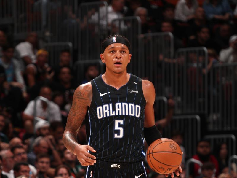 MIAMI, FL - OCTOBER 23: Paolo Banchero #5 of the Orlando Magic dribbles the ball during the game against the Miami Heat on October 23, 2024 at Kaseya Center in Miami, Florida. NOTE TO USER: User expressly acknowledges and agrees that, by downloading and or using this Photograph, user is consenting to the terms and conditions of the Getty Images License Agreement. Mandatory Copyright Notice: Copyright 2024 NBAE (Photo by Issac Baldizon/NBAE via Getty Images)