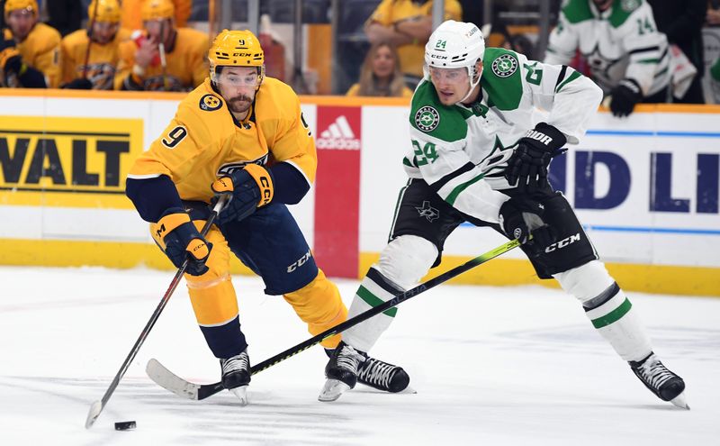 Oct 13, 2022; Nashville, Tennessee, USA; Nashville Predators left wing Filip Forsberg (9) handles the puck against Dallas Stars center Roope Hintz (24) during the third period at Bridgestone Arena. Mandatory Credit: Christopher Hanewinckel-USA TODAY Sports