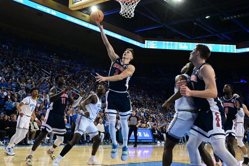 Mar 4, 2023; Los Angeles, California, USA;  Arizona Wildcats guard Pelle Larsson (3) shoots the ball during the first half against UCLA Bruins forward Kenneth Nwuba (14) at Pauley Pavilion presented by Wescom. Mandatory Credit: Richard Mackson-USA TODAY Sports