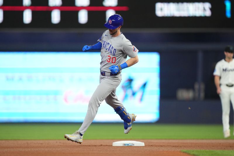 May 21, 2025; Miami, Florida, USA;  Chicago Cubs designated hitter Kyle Tucker (30) rounds the bases after a solo home run in the first inning against the Miami Marlins at loanDepot Park. Mandatory Credit: Jim Rassol-Imagn Images