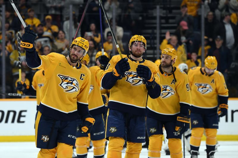 Mar 2, 2024; Nashville, Tennessee, USA; Nashville Predators defenseman Roman Josi (59) celebrates with teammates after a win against the Colorado Avalanche at Bridgestone Arena. Mandatory Credit: Christopher Hanewinckel-USA TODAY Sports