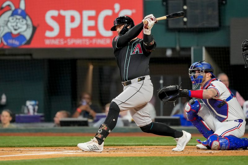 May 29, 2024; Arlington, Texas, USA; Arizona Diamondbacks first baseman Christian Walker (53) follows through on his single against the Texas Rangers during the first inning at Globe Life Field. Mandatory Credit: Jim Cowsert-USA TODAY Sports