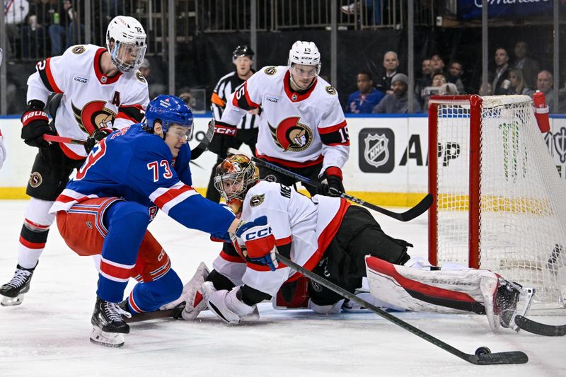 Jan 21, 2025; New York, New York, USA;  New York Rangers center Matt Rempe (73) attempts. A rebound on Ottawa Senators goaltender Leevi Merilainen (1) during the second period at Madison Square Garden. Mandatory Credit: Dennis Schneidler-Imagn Images