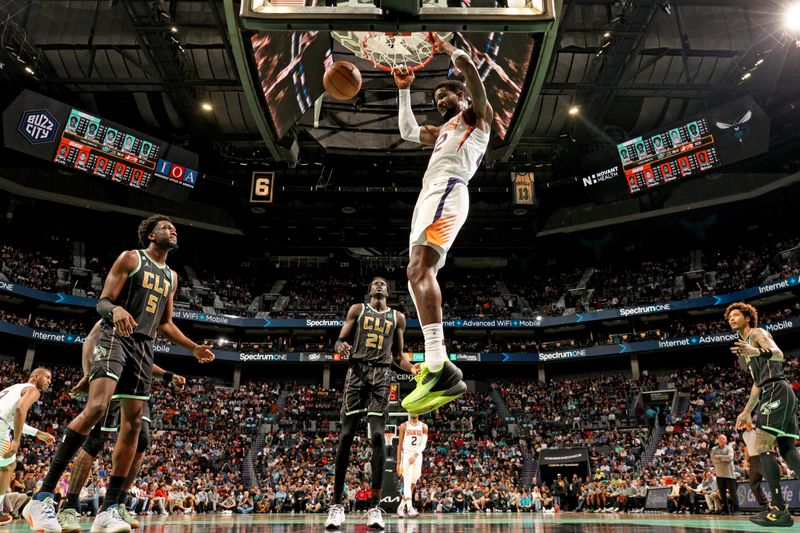 CHARLOTTE, NC - MARCH 1:  Deandre Ayton #22 of the Phoenix Suns dunks the ball against the Charlotte Hornets on March 1, 2023 at Spectrum Center in Charlotte, North Carolina. NOTE TO USER: User expressly acknowledges and agrees that, by downloading and or using this photograph, User is consenting to the terms and conditions of the Getty Images License Agreement. Mandatory Copyright Notice: Copyright 2023 NBAE (Photo by Kent Smith/NBAE via Getty Images)