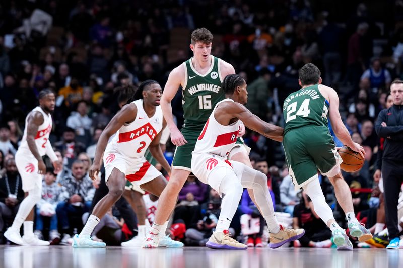 TORONTO, ON - JANUARY 6: Liam Robbins #15 of the Milwaukee Bucks sets a pick against Ochai Agbaji #30 of the Toronto Raptors at the Scotiabank Arena on January 6, 2025 in Toronto, Ontario, Canada. NOTE TO USER: User expressly acknowledges and agrees that, by downloading and/or using this Photograph, user is consenting to the terms and conditions of the Getty Images License Agreement. (Photo by Kevin Sousa/Getty Images)