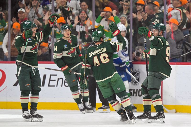 Nov 1, 2025; Saint Paul, Minnesota, USA;  Minnesota Wild forward Vladimir Tarasenko (91) celebrates his power play goal against the Vancouver Canucks with defensemen Jared Spurgeon (46) during the first period at Grand Casino Arena. Mandatory Credit: Nick Wosika-Imagn Images