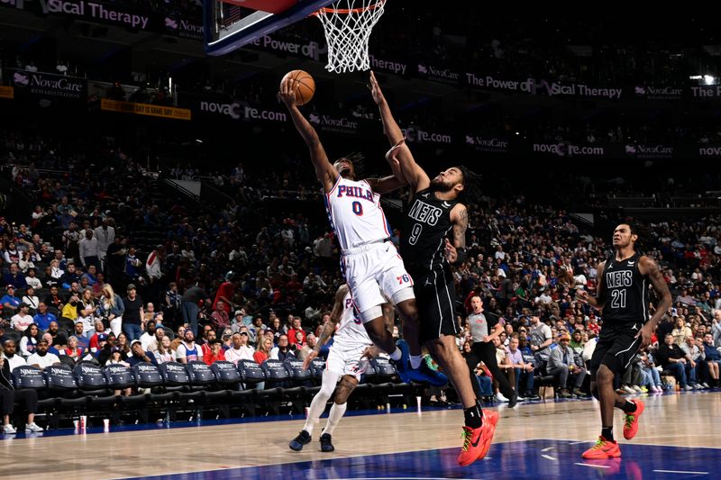 PHILADELPHIA, PA - APRIL 14:  Tyrese Maxey #0 of the Philadelphia 76ers drives to the basket during the game against the Brooklyn Nets on April 14, 2024 at the Wells Fargo Center in Philadelphia, Pennsylvania NOTE TO USER: User expressly acknowledges and agrees that, by downloading and/or using this Photograph, user is consenting to the terms and conditions of the Getty Images License Agreement. Mandatory Copyright Notice: Copyright 2024 NBAE (Photo by David Dow/NBAE via Getty Images)