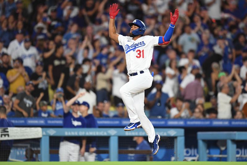 Aug 12, 2023; Los Angeles, California, USA; Los Angeles Dodgers shortstop Amed Rosario (31) celebrates after hitting a home run against the Colorado Rockies during the seventh inning at Dodger Stadium. Mandatory Credit: Jonathan Hui-USA TODAY Sports