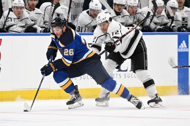 Jan 28, 2024; St. Louis, Missouri, USA; Los Angeles Kings left wing Trevor Moore (12) pressures St. Louis Blues left wing Nathan Walker (26) during the second period at Enterprise Center. Mandatory Credit: Jeff Le-USA TODAY Sports