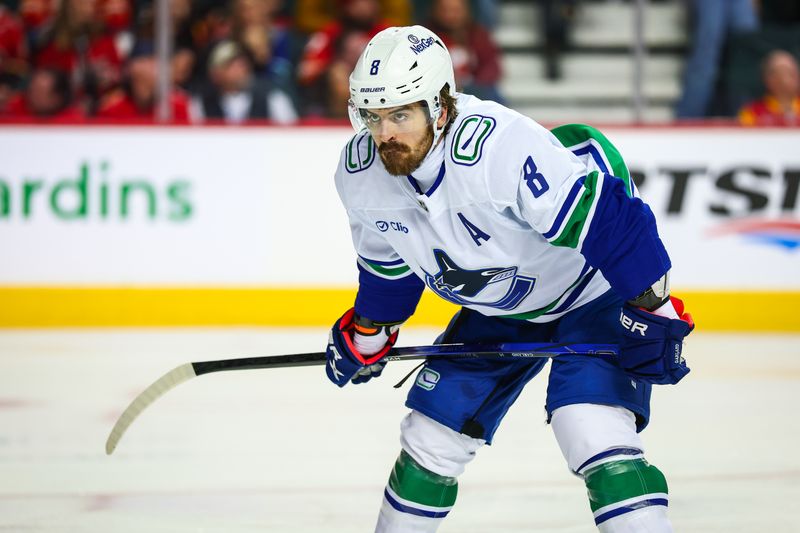 Dec 31, 2024; Calgary, Alberta, CAN; Vancouver Canucks right wing Conor Garland (8) during the face off against the Calgary Flames during the third period at Scotiabank Saddledome. Mandatory Credit: Sergei Belski-Imagn Images