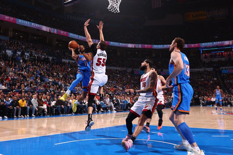 OKLAHOMA CITY, OK - MARCH 8:  Isaiah Joe #11 of the Oklahoma City Thunder drives to the basket during the game against the Miami Heat on March 8, 2024 at Paycom Arena in Oklahoma City, Oklahoma. NOTE TO USER: User expressly acknowledges and agrees that, by downloading and or using this photograph, User is consenting to the terms and conditions of the Getty Images License Agreement. Mandatory Copyright Notice: Copyright 2024 NBAE (Photo by Zach Beeker/NBAE via Getty Images)