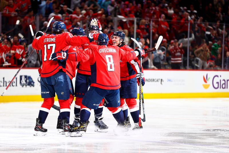 Mar 24, 2024; Washington, District of Columbia, USA; Washington Capitals defenseman John Carlson (74) celebrates with teammates after scoring a goal during the third period against the Winnipeg Jets at Capital One Arena. Mandatory Credit: Amber Searls-USA TODAY Sports