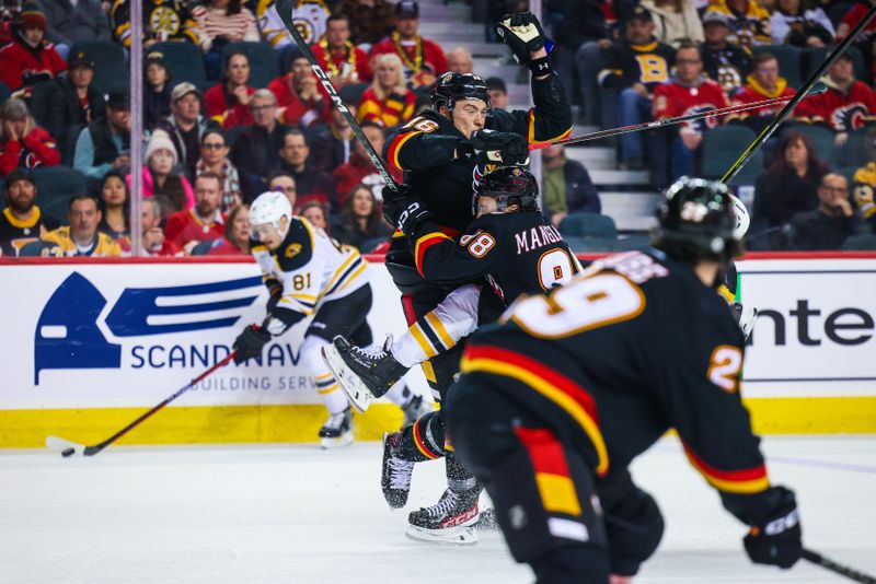 Feb 28, 2023; Calgary, Alberta, CAN; Calgary Flames defenseman Nikita Zadorov (16) and left wing Andrew Mangiapane (88) collide during the third period at Scotiabank Saddledome. Mandatory Credit: Sergei Belski-USA TODAY Sports