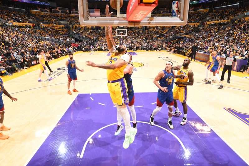 LOS ANGELES, CA - APRIL 25: Anthony Davis #3 of the Los Angeles Lakers drives to the basket during the game against the Denver Nuggets during Round 1 Game 3 of the 2024 NBA Playoffs on April 25, 2024 at Crypto.Com Arena in Los Angeles, California. NOTE TO USER: User expressly acknowledges and agrees that, by downloading and/or using this Photograph, user is consenting to the terms and conditions of the Getty Images License Agreement. Mandatory Copyright Notice: Copyright 2024 NBAE (Photo by Andrew D. Bernstein/NBAE via Getty Images)