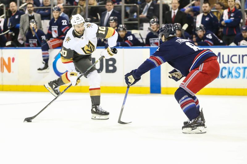 Jan 26, 2024; New York, New York, USA; Vegas Golden Knights center Nicolas Roy (10) attempts a shot on goal past New York Rangers defenseman Jacob Trouba (8) in the first period at Madison Square Garden. Mandatory Credit: Wendell Cruz-USA TODAY Sports