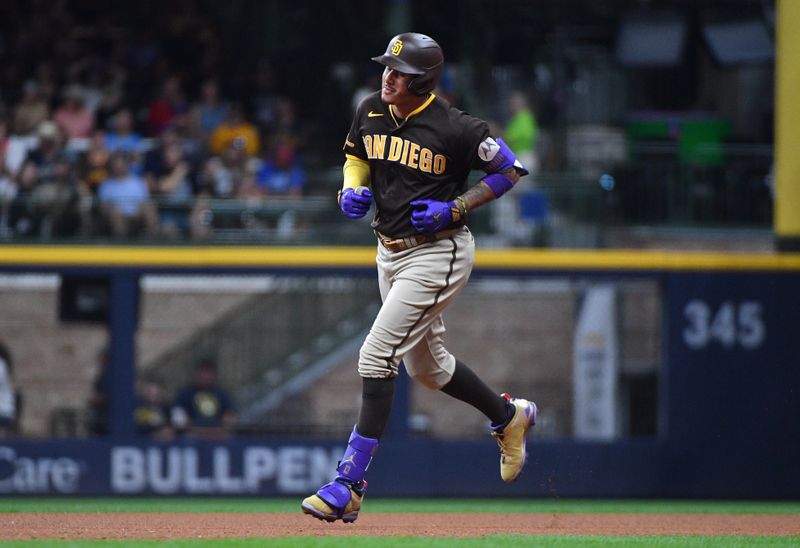 Aug 25, 2023; Milwaukee, Wisconsin, USA; San Diego Padres third baseman Manny Machado (13) rounds the bases after hitting a home run in the fourth inning against the Milwaukee Brewers at American Family Field. Mandatory Credit: Michael McLoone-USA TODAY Sports