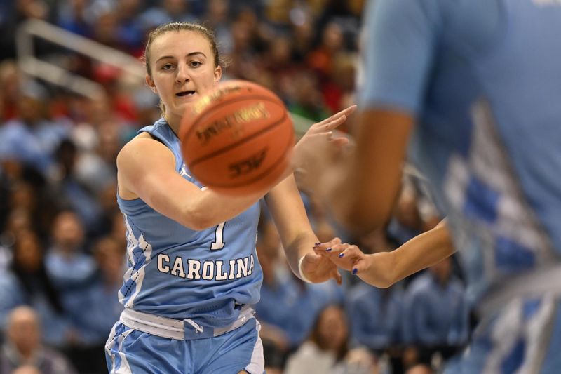 Mar 3, 2023; Greensboro, NC, USA; North Carolina Tar Heels guard Alyssa Ustby (1) passes to a teammate during the first half at Greensboro Coliseum. Mandatory Credit: William Howard-USA TODAY Sports