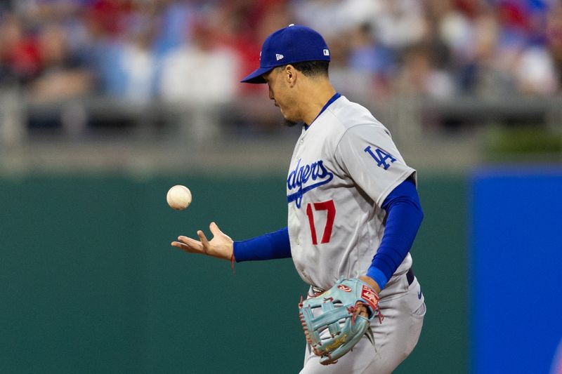 Jun 9, 2023; Philadelphia, Pennsylvania, USA; Los Angeles Dodgers second baseman Miguel Vargas (17) is unable to handle the single of Philadelphia Phillies third baseman Edmundo Sosa (33) during the fifth inning at Citizens Bank Park. Mandatory Credit: Bill Streicher-USA TODAY Sports