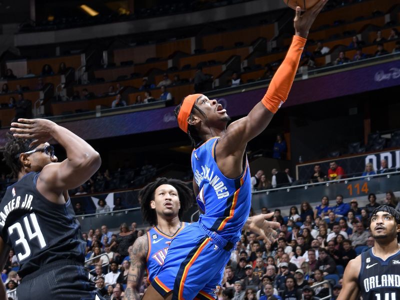 ORLANDO, FL - JANUARY 4: Shai Gilgeous-Alexander #2 of the Oklahoma City Thunder goes to the basket against the Orlando Magic  on January 4, 2023 at Amway Center in Orlando, Florida. NOTE TO USER: User expressly acknowledges and agrees that, by downloading and or using this photograph, User is consenting to the terms and conditions of the Getty Images License Agreement. Mandatory Copyright Notice: Copyright 2023 NBAE (Photo by Gary Bassing/NBAE via Getty Images)