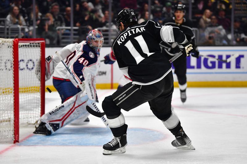 Mar 16, 2023; Los Angeles, California, USA; Los Angeles Kings center Anze Kopitar (11) scores a goal against Columbus Blue Jackets goaltender Daniil Tarasov (40) during the second period at Crypto.com Arena. Mandatory Credit: Gary A. Vasquez-USA TODAY Sports