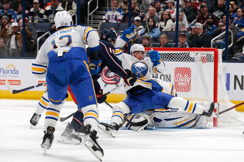 Feb 23, 2024; Columbus, Ohio, USA; Buffalo Sabres defenseman Connor Clifton (75) falls to the ice after colliding with Columbus Blue Jackets left wing Dmitri Voronkov (10) during the third period at Nationwide Arena. Mandatory Credit: Russell LaBounty-USA TODAY Sports