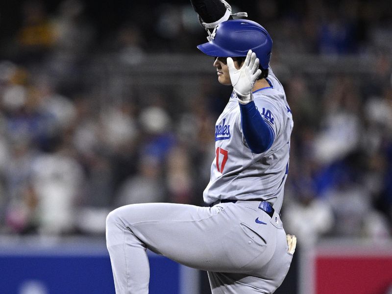 May 10, 2024; San Diego, California, USA; Los Angeles Dodgers designated hitter Shohei Ohtani (17) celebrates after hitting a double against the San Diego Padres during the eighth inning at Petco Park. Mandatory Credit: Orlando Ramirez-USA TODAY Sports