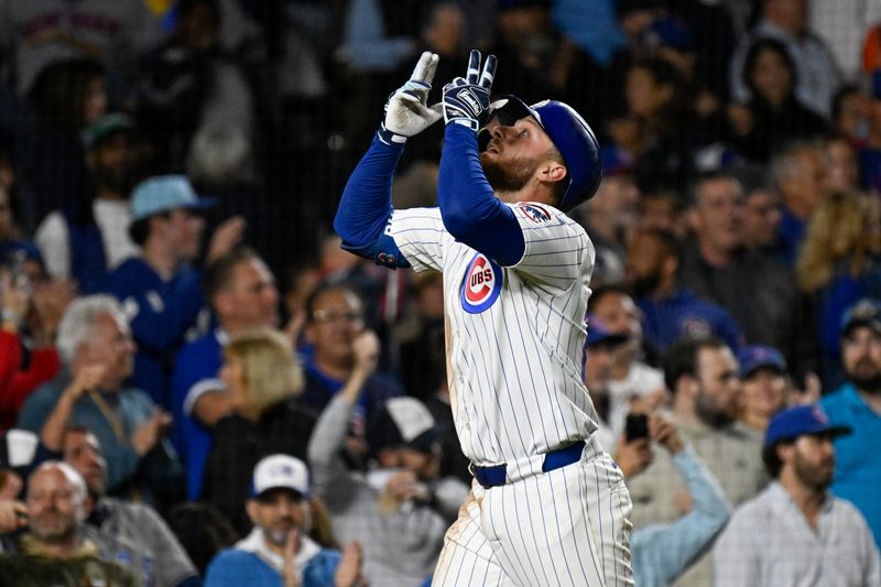 Sep 24, 2025; Chicago, Illinois, USA;  Chicago Cubs first baseman Michael Busch (29) points after hitting a two run home run during the sixth inning against the New York Mets  at Wrigley Field. Mandatory Credit: Matt Marton-Imagn Images