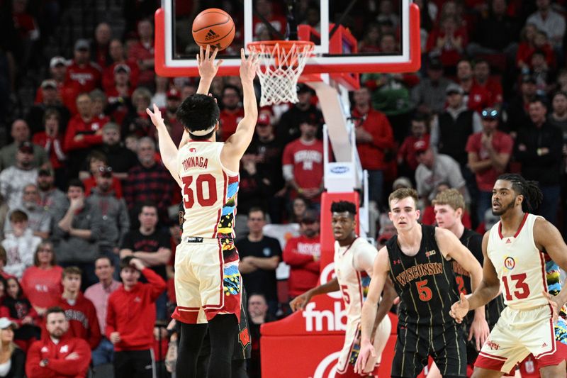 Feb 11, 2023; Lincoln, Nebraska, USA;  Nebraska Cornhuskers guard Keisei Tominaga (30) scores on a three point basket against the Wisconsin Badgers in the second half at Pinnacle Bank Arena. Mandatory Credit: Steven Branscombe-USA TODAY Sports