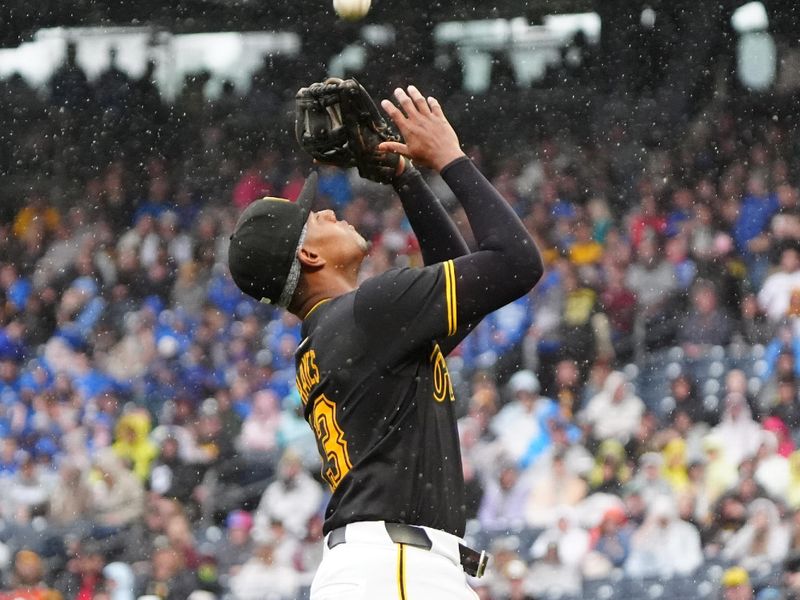 May 4, 2024; Pittsburgh, Pennsylvania, USA; Pittsburgh Pirates third baseman Ke'Bryan Hayes (13) catches a fly ball hit by Colorado Rockies designated hitter Charlie Blackmon (not pictured) during the eighth inning at PNC Park. Mandatory Credit: Gregory Fisher-USA TODAY Sports