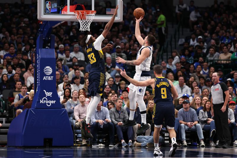 DALLAS, TEXAS - NOVEMBER 04: Luka Doncic #77 of the Dallas Mavericks makes a move to the basket as Myles Turner #33 of the Indiana Pacers \defends during the second half at American Airlines Center on November 04, 2024 in Dallas, Texas. NOTE TO USER: User expressly acknowledges and agrees that, by downloading and or using this photograph, User is consenting to the terms and conditions of the Getty Images License Agreement. (Photo by Sam Hodde/Getty Images)