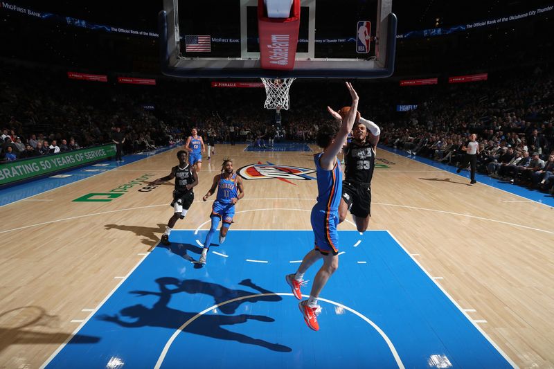 OKLAHOMA CITY, OK - APRIL 10:  Tre Jones #33 of the San Antonio Spurs drives to the basket during the game against the Oklahoma City Thunder on April 10, 2024 at Paycom Arena in Oklahoma City, Oklahoma. NOTE TO USER: User expressly acknowledges and agrees that, by downloading and or using this photograph, User is consenting to the terms and conditions of the Getty Images License Agreement. Mandatory Copyright Notice: Copyright 2024 NBAE (Photo by Zach Beeker/NBAE via Getty Images)