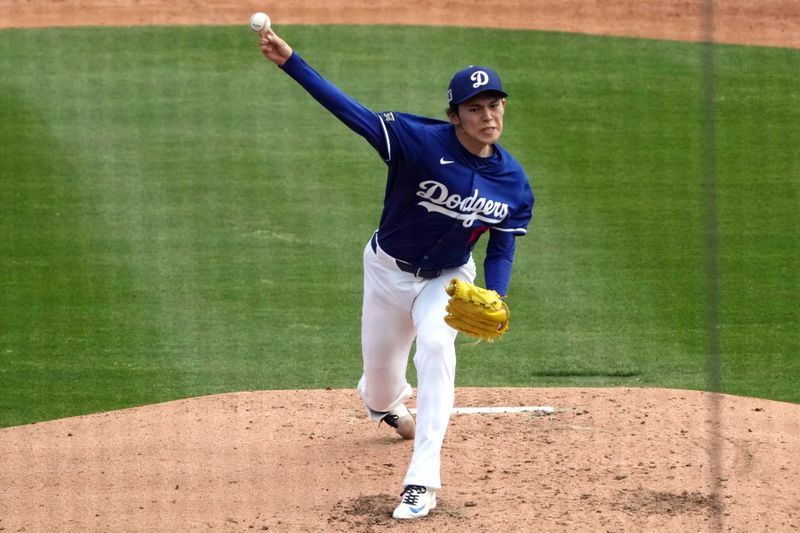 Mar 11, 2025; Phoenix, Arizona, USA; Los Angeles Dodgers pitcher Roki Sasaki (11) throws against the Cleveland Guardians in the third inning at Camelback Ranch-Glendale. Mandatory Credit: Rick Scuteri-Imagn Images