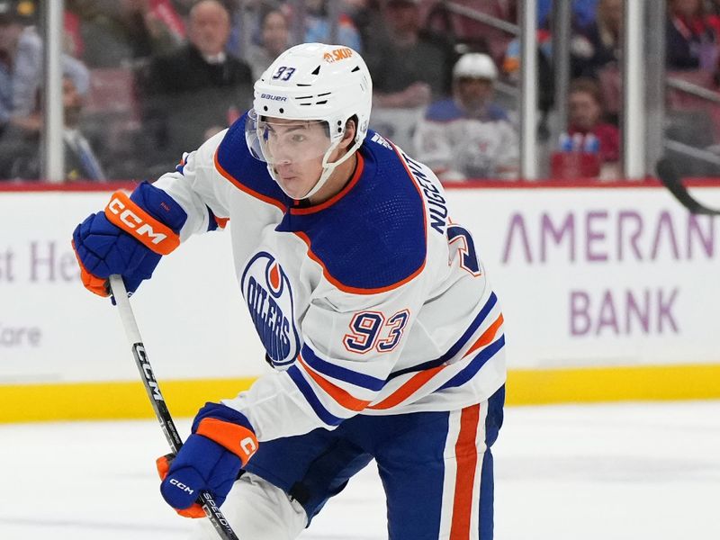 Nov 20, 2023; Sunrise, Florida, USA; Edmonton Oilers center Ryan Nugent-Hopkins (93) shoots the puck against the Florida Panthers during the first period at Amerant Bank Arena. Mandatory Credit: Jasen Vinlove-USA TODAY Sports