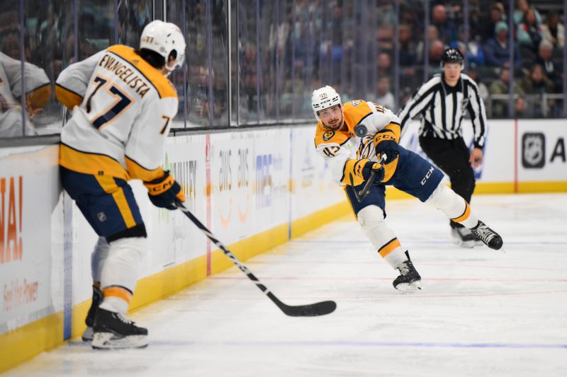 Nov 2, 2023; Seattle, Washington, USA; Nashville Predators defenseman Alexandre Carrier (45) passes against the Seattle Kraken during the second period at Climate Pledge Arena. Mandatory Credit: Steven Bisig-USA TODAY Sports