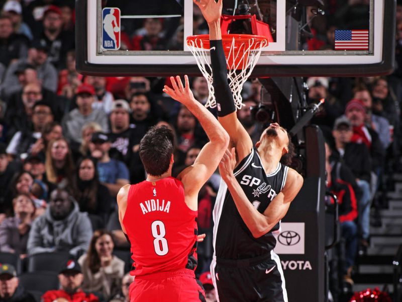 PORTLAND, OR - DECEMBER 13: Victor Wembanyama #1 of the San Antonio Spurs blocks shots during the game against the Portland Trail Blazers on December 13, 2024 at the Moda Center Arena in Portland, Oregon. NOTE TO USER: User expressly acknowledges and agrees that, by downloading and or using this photograph, user is consenting to the terms and conditions of the Getty Images License Agreement. Mandatory Copyright Notice: Copyright 2024 NBAE (Photo by Cameron Browne/NBAE via Getty Images)