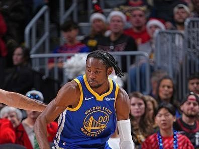 DENVER, CO - DECEMBER 25: Jonathan Kuminga #00 of the Golden State Warriors dribbles the ball during the game against the Golden State Warriors on December 25, 2023 at the Ball Arena in Denver, Colorado. NOTE TO USER: User expressly acknowledges and agrees that, by downloading and/or using this Photograph, user is consenting to the terms and conditions of the Getty Images License Agreement. Mandatory Copyright Notice: Copyright 2023 NBAE (Photo by Garrett Ellwood/NBAE via Getty Images)