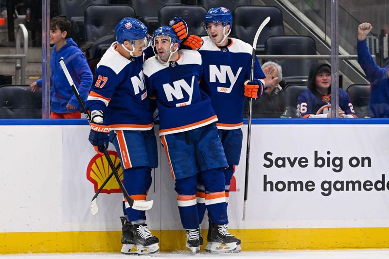 Mar 5, 2024; Elmont, New York, USA;  New York Islanders center Kyle Palmieri (21) celebrates his goal with left wing Anders Lee (27) and defenseman Noah Dobson (8) during the second period against the St. Louis Blues at UBS Arena. Mandatory Credit: Dennis Schneidler-USA TODAY Sports