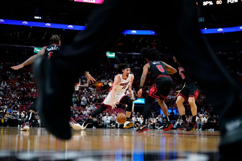 MIAMI, FLORIDA - APRIL 19: Jaime Jaquez Jr. #11 of the Miami Heat dribbles the ball against the Chicago Bulls in the first quarter during the Play-In Tournament at Kaseya Center on April 19, 2024 in Miami, Florida. NOTE TO USER: User expressly acknowledges and agrees that, by downloading and or using this photograph, User is consenting to the terms and conditions of the Getty Images License Agreement. (Photo by Rich Storry/Getty Images)