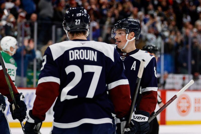 Jan 18, 2025; Denver, Colorado, USA; Colorado Avalanche defenseman Cale Makar (8) celebrates his goal with left wing Jonathan Drouin (27) in the second period against the Dallas Stars at Ball Arena. Mandatory Credit: Isaiah J. Downing-Imagn Images