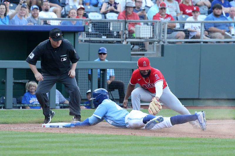 Jun 17, 2023; Kansas City, Missouri, USA; Kansas City Royals pinch runner Dairon Blanco (44) slides safely into third base as Los Angeles Angels third baseman Luis Rengifo (2) is late on the tag in the ninth inning at Kauffman Stadium. Mandatory Credit: Scott Sewell-USA TODAY Sports